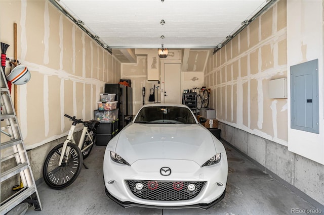 garage featuring electric panel and a garage door opener