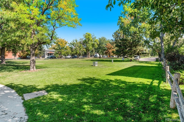 view of property's community with a yard