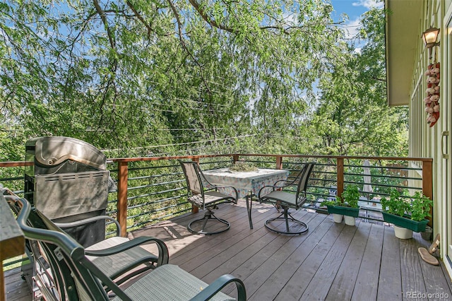 1080 Ithaca Dr, Boulder, CO 80305 - deck with outdoor dining area, view of scattered trees, and grilling area