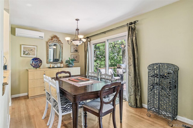 1080 Ithaca Dr, Boulder, CO 80305 - dining room with a wall mounted AC, light wood-type flooring, and a chandelier