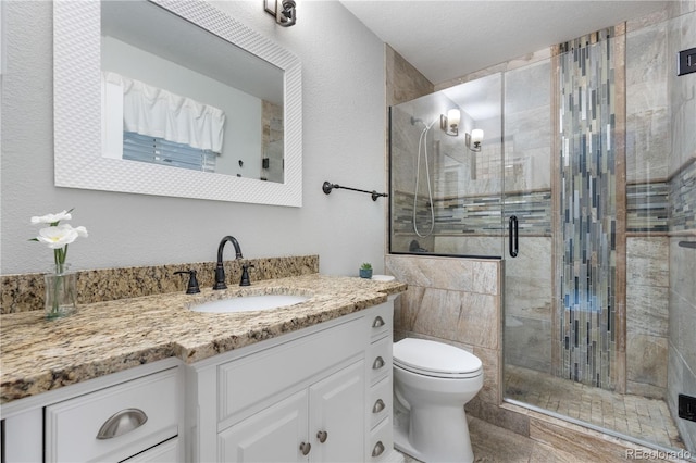 9960 Garland Ln, Broomfield, CO 80021 - bathroom with a stall shower, toilet, and vanity