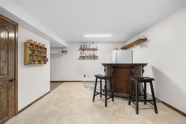 9960 Garland Ln, Broomfield, CO 80021 - indoor dry bar with freestanding refrigerator, carpet flooring, and baseboards