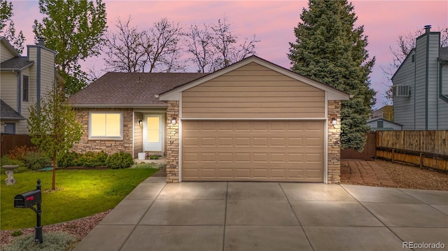 9960 Garland Ln, Broomfield, CO 80021 - view of front of property featuring stone siding, a shingled roof, an attached garage, and concrete driveway