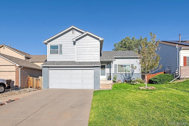 view of front facade with a front yard and a garage