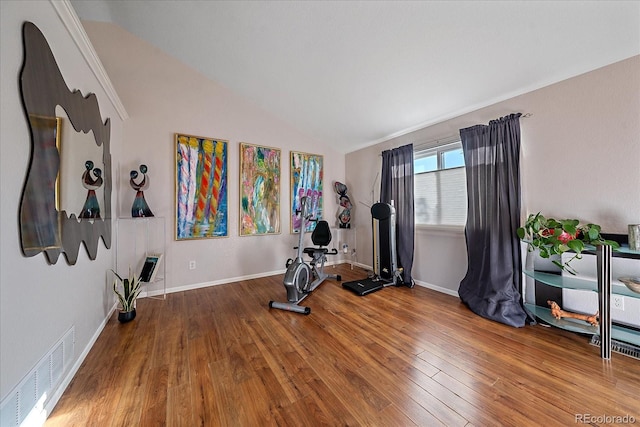 workout room featuring wood-type flooring and lofted ceiling