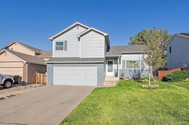 view of front of property with a front yard and a garage