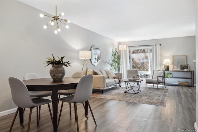 dining room with an inviting chandelier and dark hardwood / wood-style floors