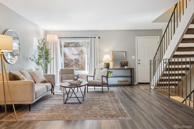 living room with dark hardwood / wood-style flooring