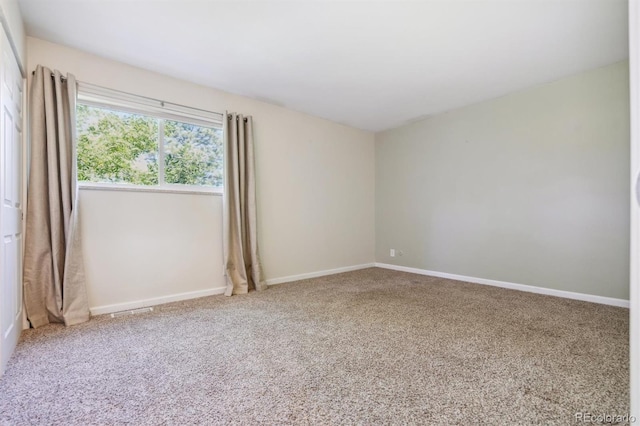 view of carpeted spare room