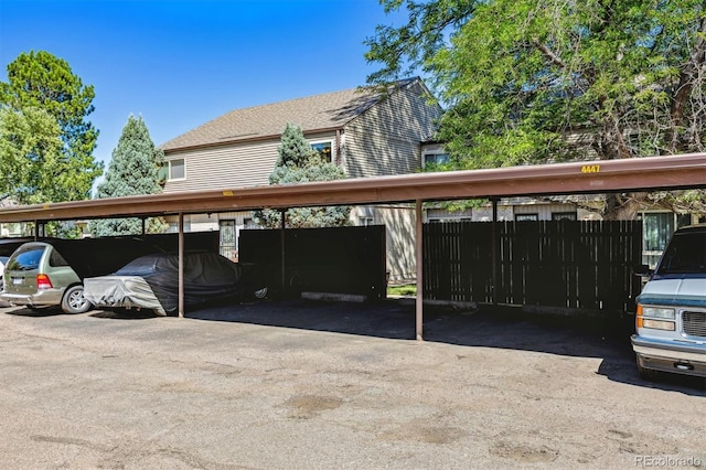 view of vehicle parking featuring a carport