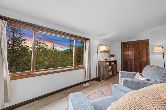 bedroom featuring light hardwood / wood-style flooring and vaulted ceiling