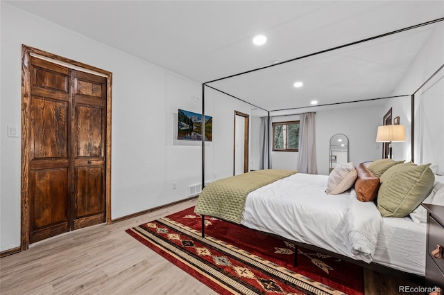 bedroom with light hardwood / wood-style flooring