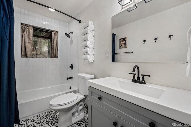 full bathroom featuring shower / bath combo with shower curtain, tile patterned floors, toilet, and vanity