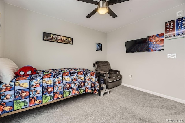 bedroom with a ceiling fan, baseboards, and carpet floors