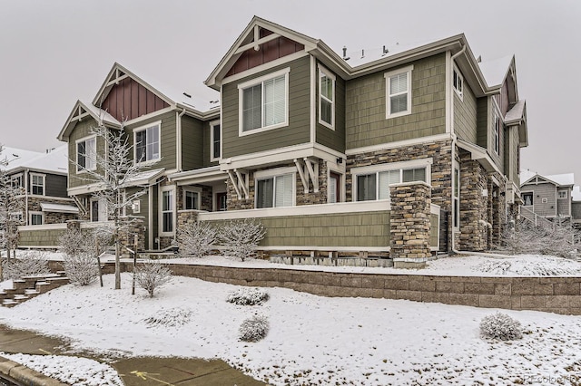 exterior space featuring stone siding and board and batten siding