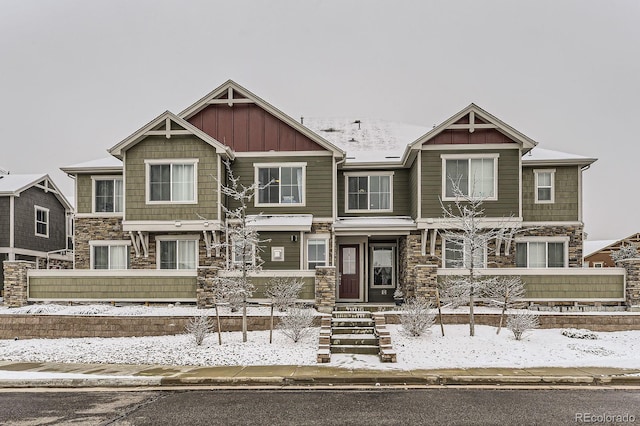 view of front of property with stone siding and board and batten siding