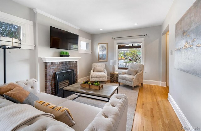 401 S Williams St, Denver, CO 80209 - living area with light wood finished floors, baseboards, recessed lighting, and a brick fireplace