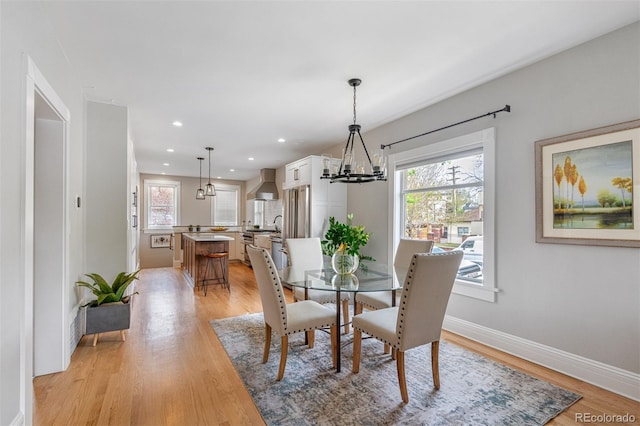 401 S Williams St, Denver, CO 80209 - dining room with a chandelier, light wood-style flooring, baseboards, and recessed lighting