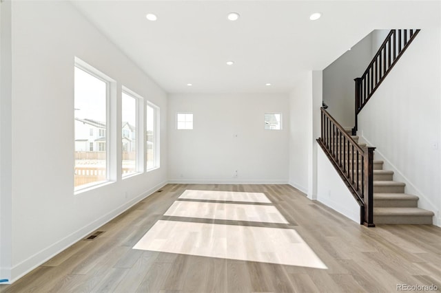 spare room featuring light hardwood / wood-style floors