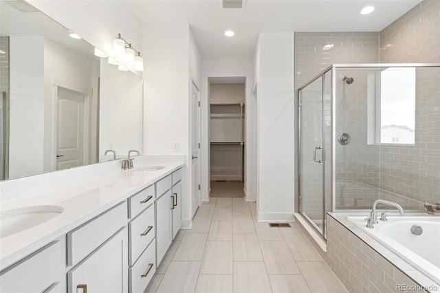 bathroom with vanity and plus walk in shower