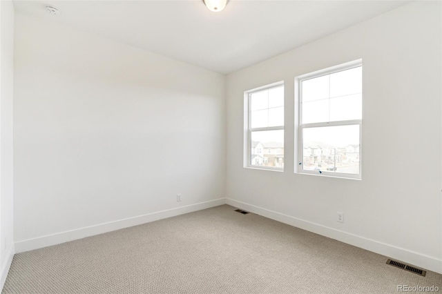 unfurnished room featuring carpet floors