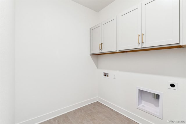 clothes washing area featuring washer hookup, hookup for an electric dryer, and cabinets