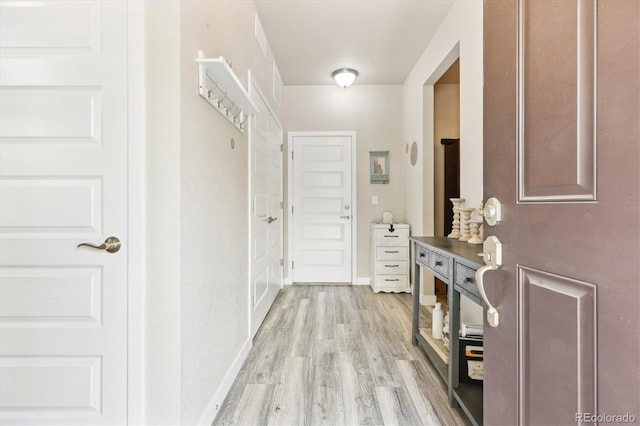 2395 S Troy Ct, Aurora, CO 80014 - hall featuring light wood finished floors and baseboards