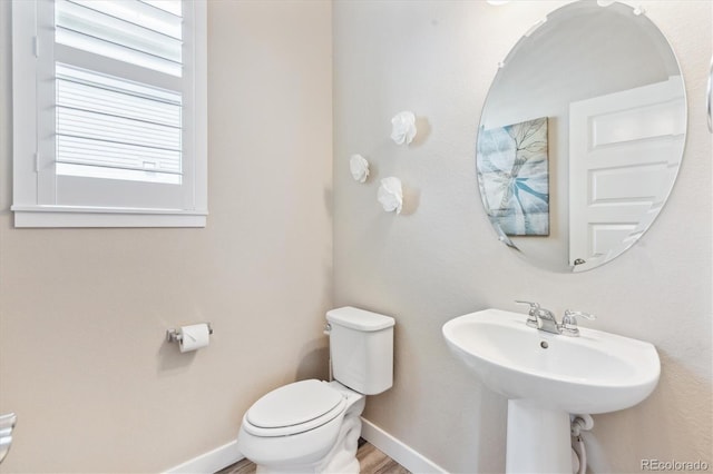 2395 S Troy Ct, Aurora, CO 80014 - half bath featuring toilet and baseboards