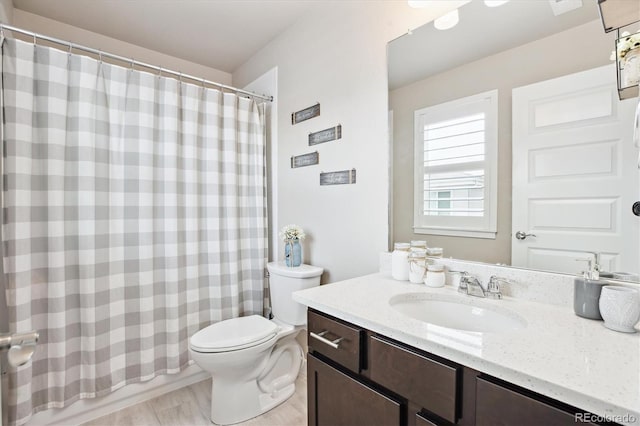 2395 S Troy Ct, Aurora, CO 80014 - full bathroom featuring vanity and wood finished floors