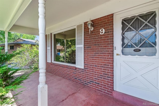 9 Rangeview Dr, Wheat Ridge, CO 80215 - entrance to property with brick siding and a porch