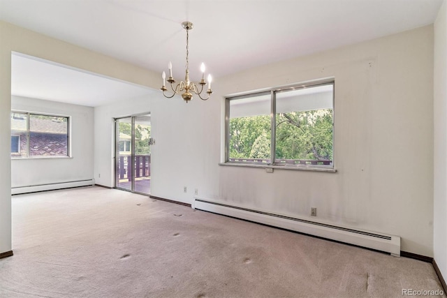 9 Rangeview Dr, Wheat Ridge, CO 80215 - carpeted empty room featuring a baseboard radiator, a baseboard heating unit, and a chandelier