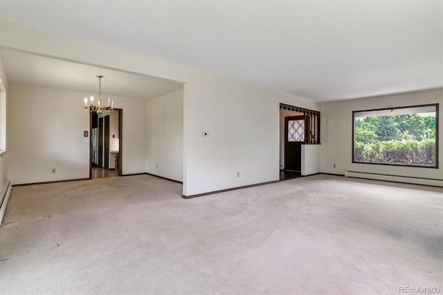 9 Rangeview Dr, Wheat Ridge, CO 80215 - empty room with baseboard heating, a chandelier, and light colored carpet