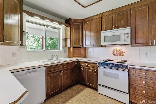 9 Rangeview Dr, Wheat Ridge, CO 80215 - kitchen featuring white appliances, light countertops, light flooring, and decorative backsplash