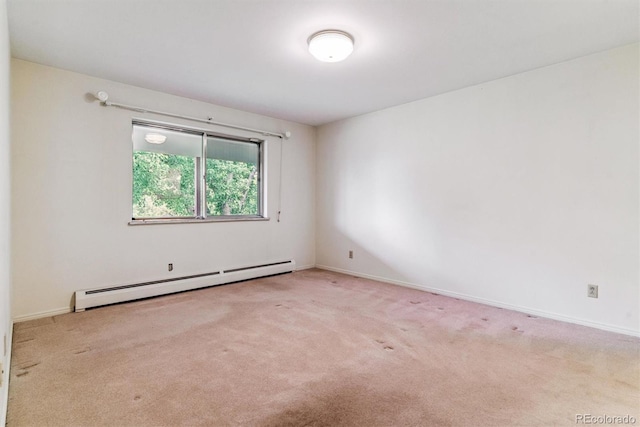 9 Rangeview Dr, Wheat Ridge, CO 80215 - carpeted empty room with a baseboard radiator and baseboards