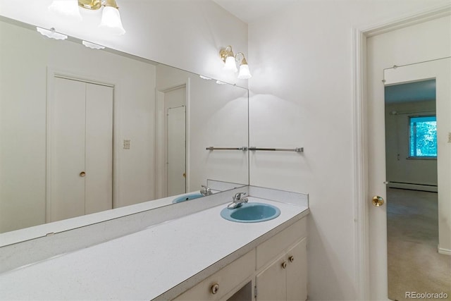 9 Rangeview Dr, Wheat Ridge, CO 80215 - bathroom with a baseboard heating unit and vanity