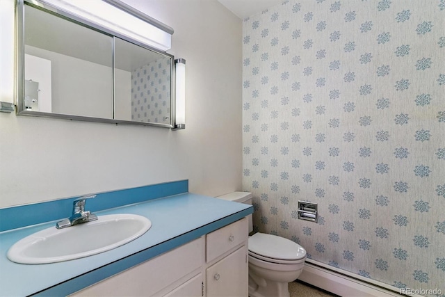 9 Rangeview Dr, Wheat Ridge, CO 80215 - bathroom featuring a baseboard radiator, vanity, and wallpapered walls