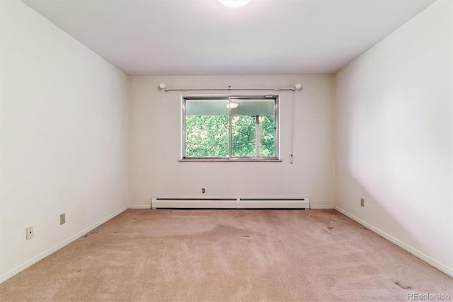9 Rangeview Dr, Wheat Ridge, CO 80215 - carpeted empty room featuring a baseboard heating unit and baseboards