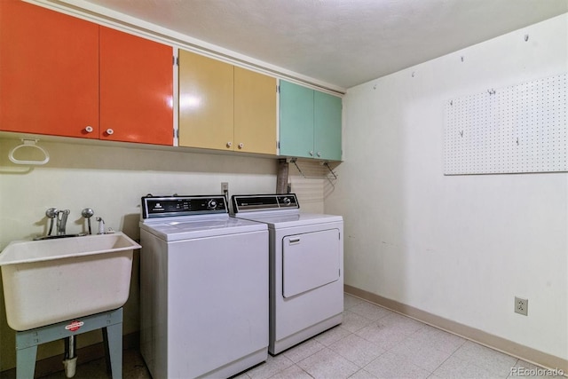 9 Rangeview Dr, Wheat Ridge, CO 80215 - laundry room featuring cabinet space and washing machine and dryer