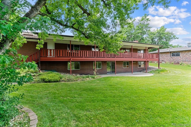 9 Rangeview Dr, Wheat Ridge, CO 80215 - rear view of property featuring a yard, brick siding, a patio area, a wooden deck, and a chimney