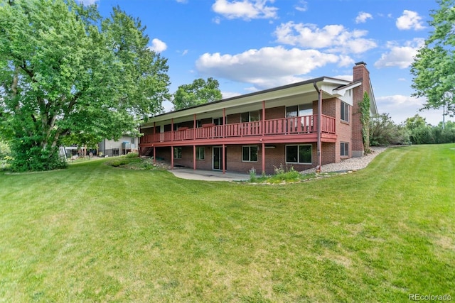 9 Rangeview Dr, Wheat Ridge, CO 80215 - rear view of property with brick siding, a chimney, a yard, and a patio area