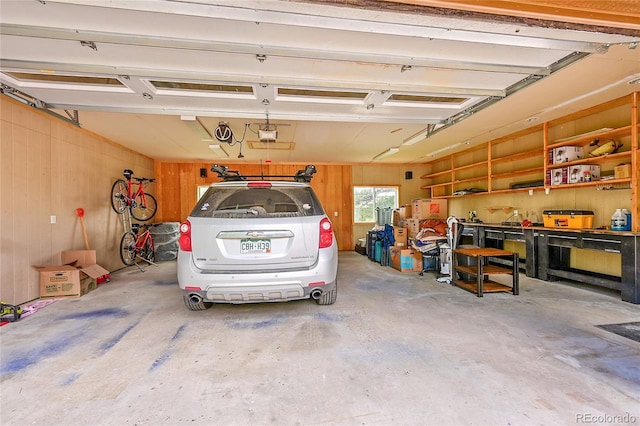 10436 Jeanette Ct, Morrison, CO 80465 - garage featuring wood walls and a garage door opener