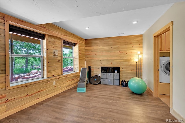 10436 Jeanette Ct, Morrison, CO 80465 - workout area featuring washer / dryer, wood finished floors, recessed lighting, and wooden walls