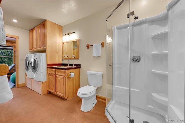 10436 Jeanette Ct, Morrison, CO 80465 - full bath with washing machine and clothes dryer, a shower stall, vanity, and recessed lighting