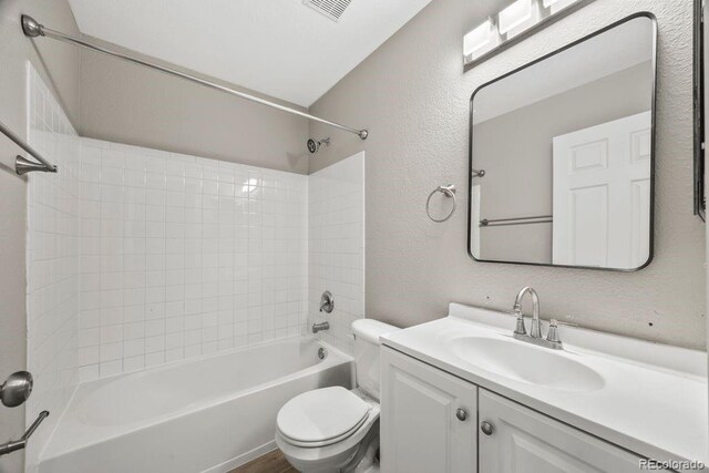 5796 E 129th Pl, Thornton, CO 80602 - full bathroom featuring vanity, bathing tub / shower combination, and a textured wall