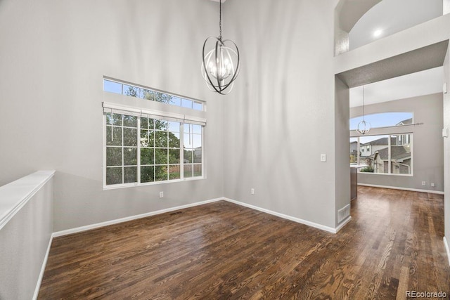 5796 E 129th Pl, Thornton, CO 80602 - empty room featuring a chandelier, wood finished floors, and a high ceiling