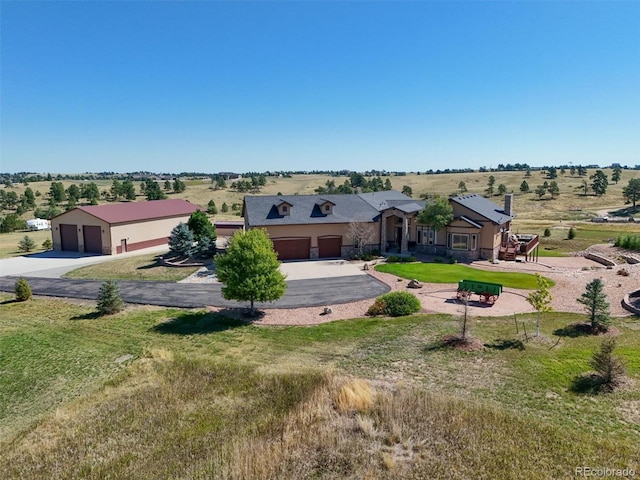11624 Dunrich Rd, Parker, CO 80138 - view of front of house with a garage and a front lawn