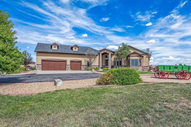 11624 Dunrich Rd, Parker, CO 80138 - view of front of property with stone siding, stucco siding, an attached garage, a front yard, and asphalt driveway