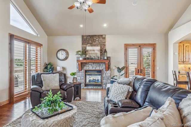 11624 Dunrich Rd, Parker, CO 80138 - living area featuring vaulted ceiling, ceiling fan, healthy amount of natural light, wood finished floors, and recessed lighting
