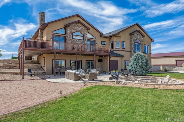 11624 Dunrich Rd, Parker, CO 80138 - back of property featuring stucco siding, an outdoor living space with a fire pit, a yard, a chimney, and a patio