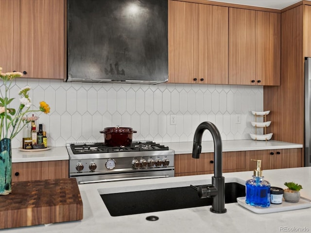 1612 Wolff St, Denver, CO 80204 - kitchen with exhaust hood, brown cabinets, and light countertops